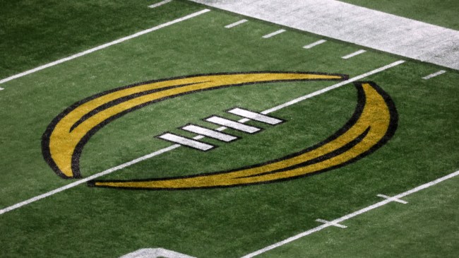 A College Football Playoff logo on the field.