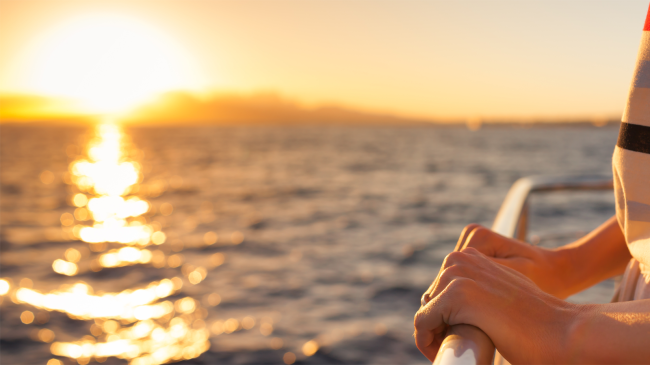 woman holding handrail on a cruise ship