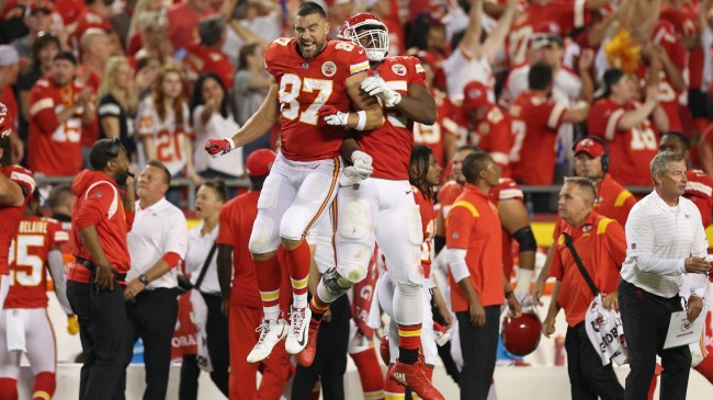 Chris Jones and Travis Kelce celebrate on the sidelines.