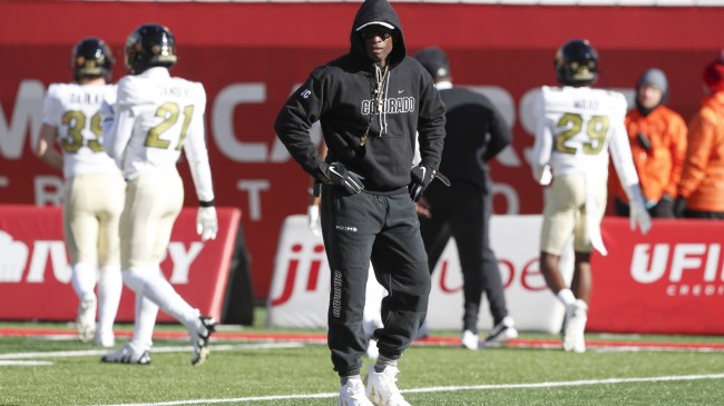 Deion Sanders on the field before a game between Utah and Colorado.