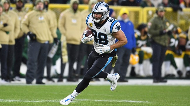 Greg Olsen runs with the ball during a game between the Panthers and Packers.