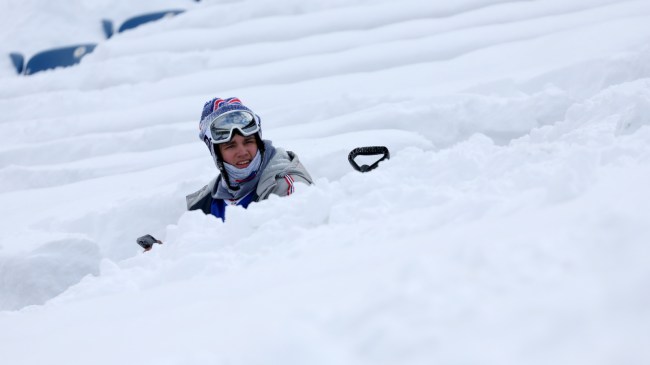 A Bills fan sits in the snowy seats ahead of a playoff matchup between Buffalo and Pittsburgh.