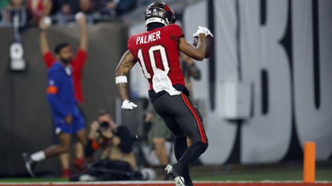 Bucs WR Trey Palmer scores a touchdown in the playoffs.