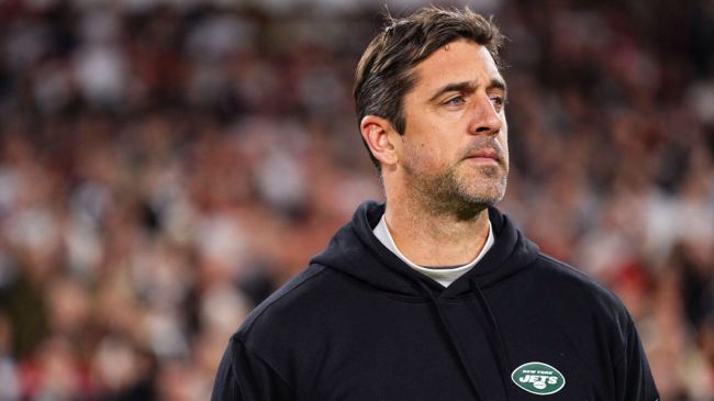 aaron rodgers in a black jets hoodie
