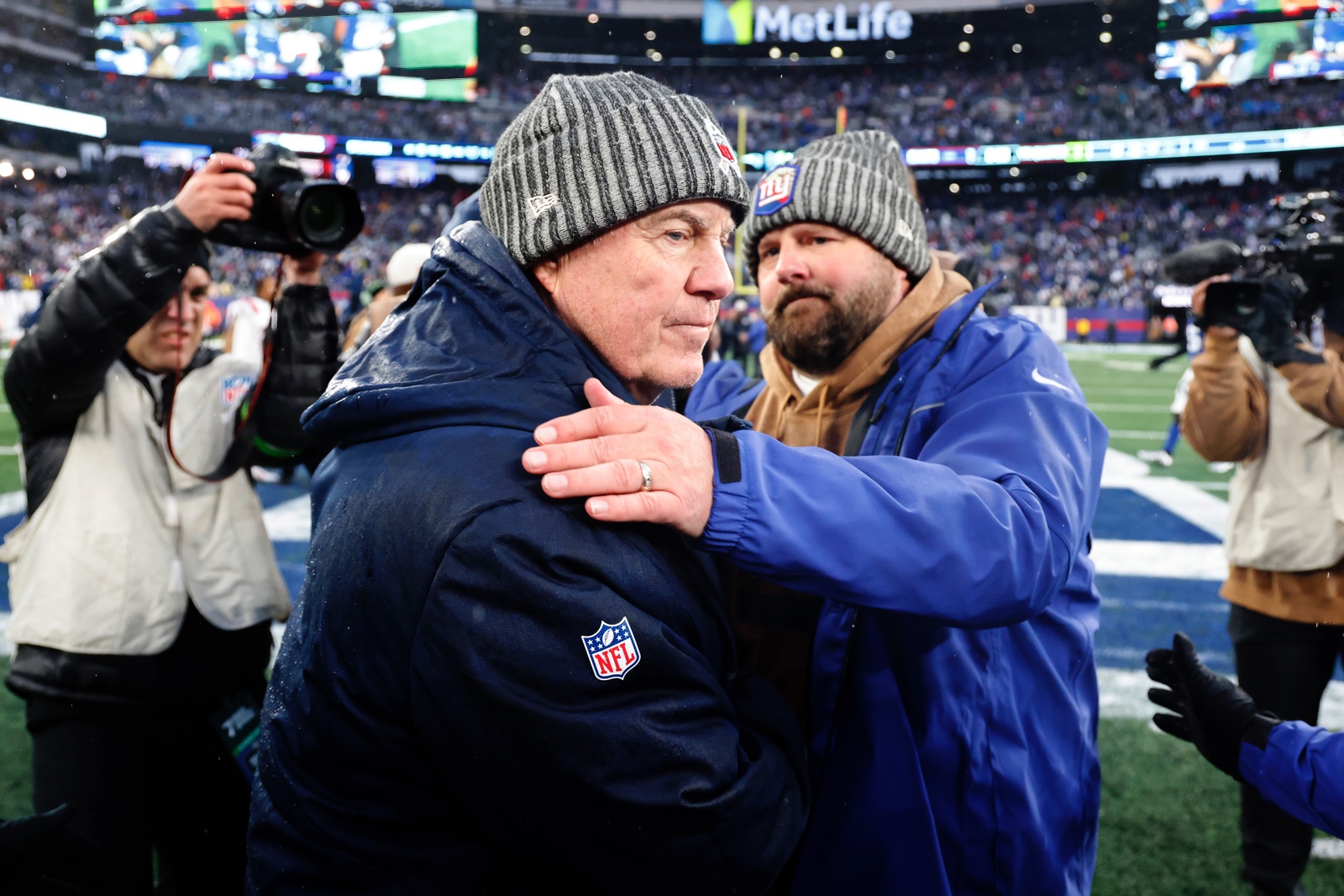 Bill Belichick and Brian Daboll shaking hands