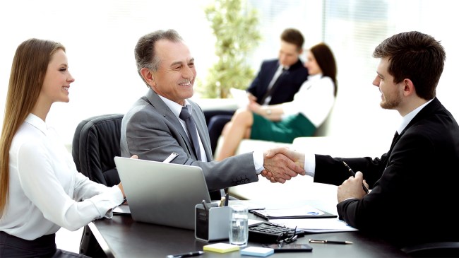 girl and her father at job interview