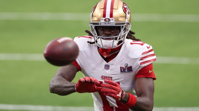 49ers WR Brandon Aiyuk warms up before Super Bowl LVIII.