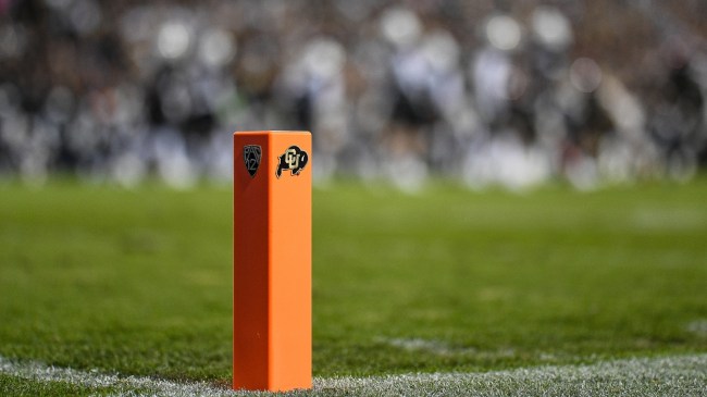 A Colorado Buffs logo on a pylon at the goal line.
