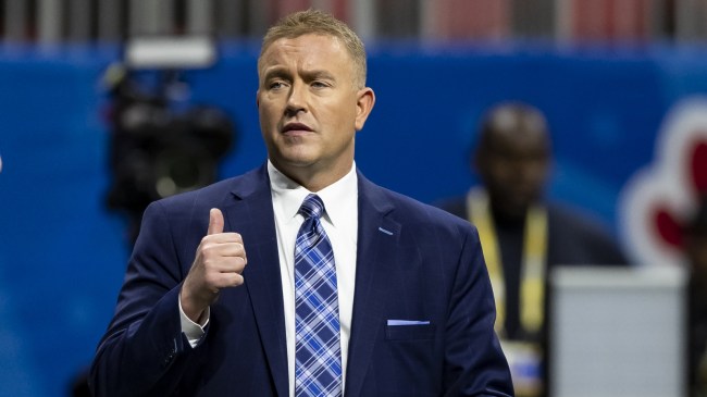 Kirk Herbstreit on the field before a football game.