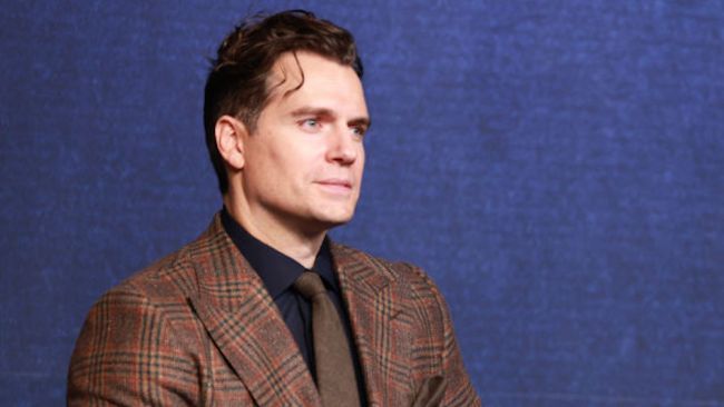henry cavill in a brown suit