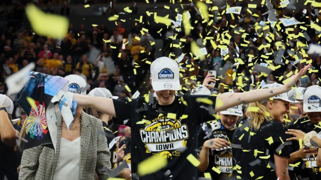 Caitlin Clark celebrates Iowa's Big Ten conference championship.