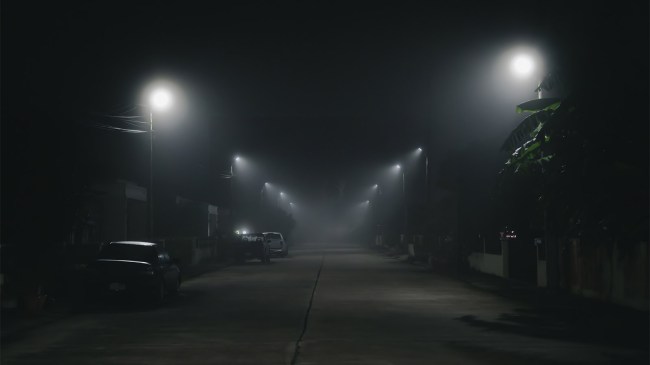 road at night with ghost