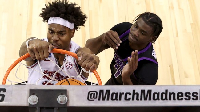 Alabama's Nick Pringle dunks over a Grand Canyon defender.