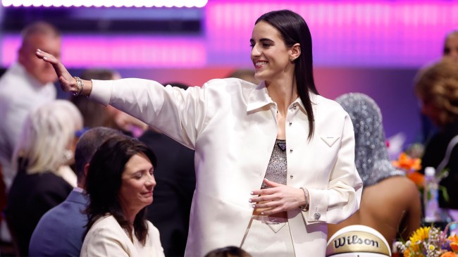Caitlin Clark waves prior to the 2024 WNBA Draft