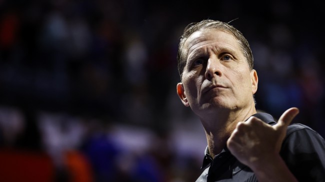 Eric Musselman walks off the court at an Arkansas basketball game.