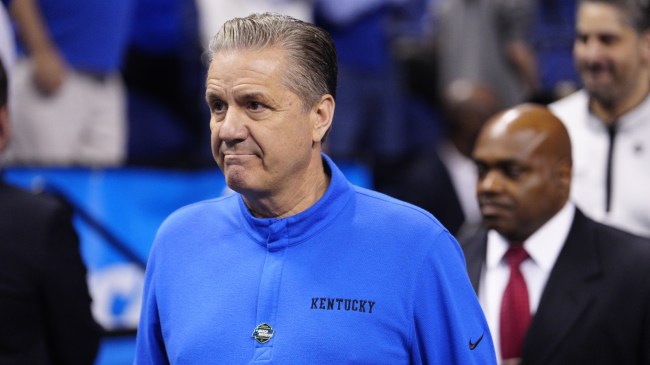 John Calipari walks off the court after a Kentucky basketball game.