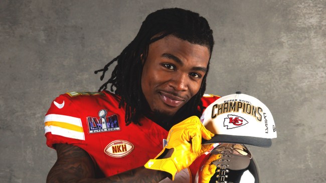 Rashee Rice poses with Lombardi trophy