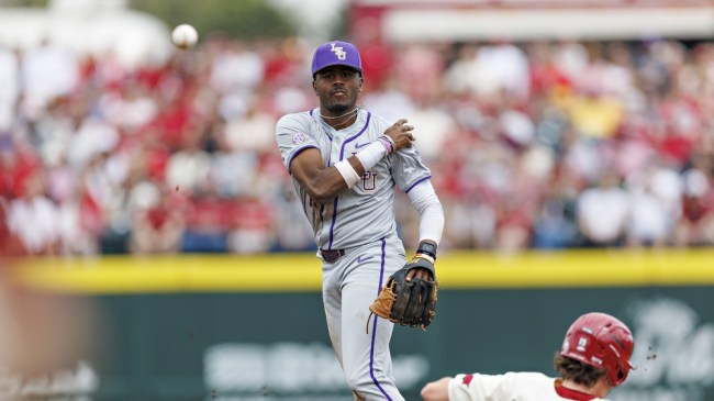 LSU infielder Michael Braswell attempts to turn a double play.