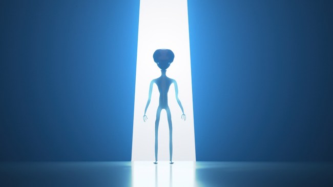 Silhouette of alien in light beam