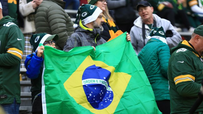 Packers fans holding Brazil flag