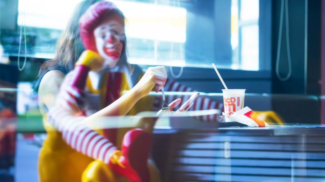 woman eating mcdonalds ronald sitting