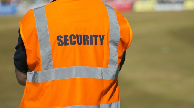 A security member watches a sporting event.