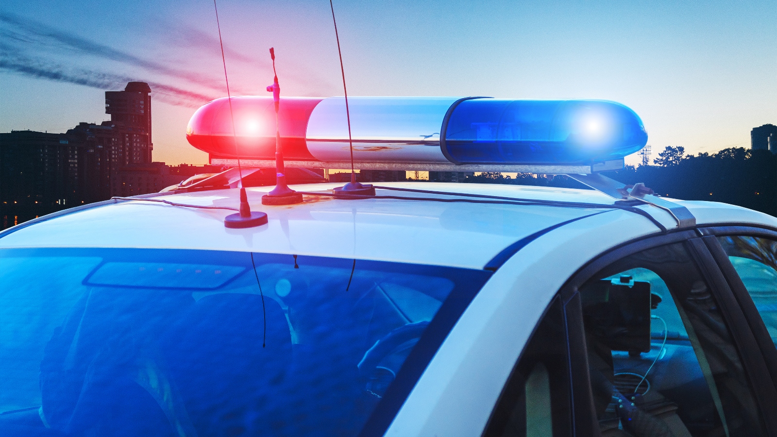 red and blue lights on a police cruiser