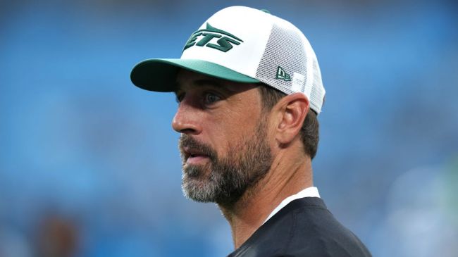 aaron rodgers in a white jets hat