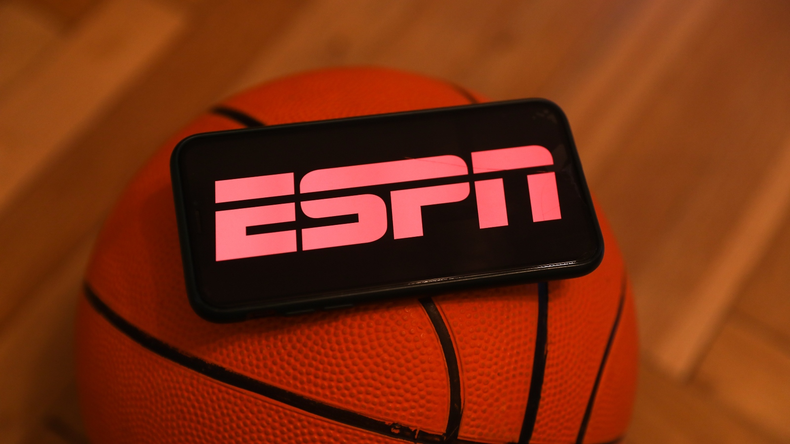 ESPN logo on an iPhone on a basketball