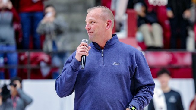 Kalen DeBoer speaks at an Alabama basketball game.