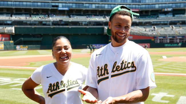 Steph Curry and wife, Ayesha, throw out the first pitch at an Oakland A's game.