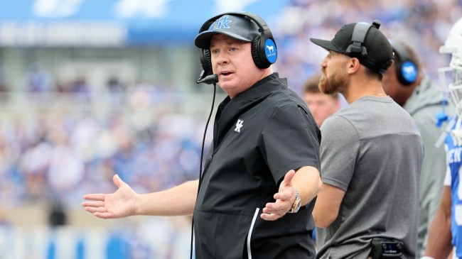 Kentucky head football coach Mark Stoops questions a call from the sidelines.
