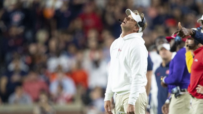 Ole Miss football coach Lane Kiffin reacts to a play on the sidelines.