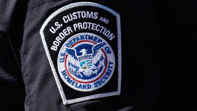 US Customs and Border Protection patch is displayed on the arm of an officer