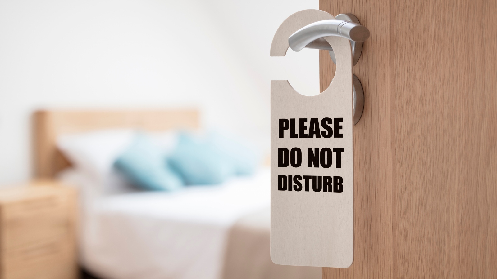 do not disturb sign hanging from a hotel door