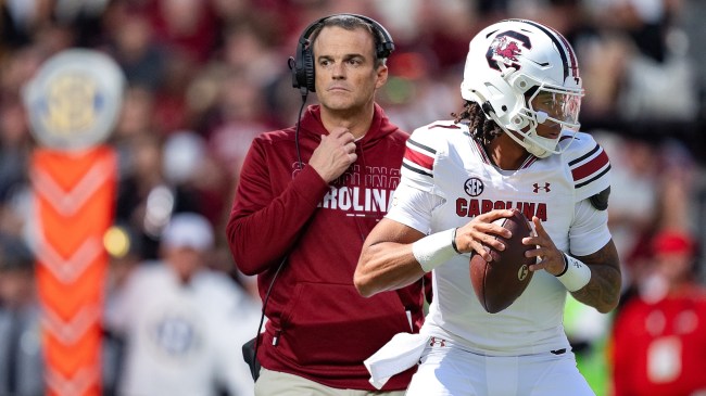South Carolina football coach Shane Beamer beside QB Robby Ashford.