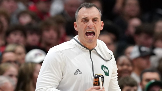 Green Bay basketball coach Doug Gottlieb on the bench.