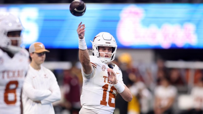 Texas QB Arch Manning warms up before a game.