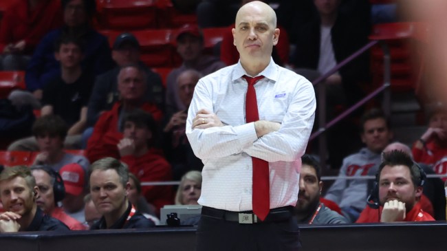 Utah basketball coach Craig Smith on the sidelines during a game.
