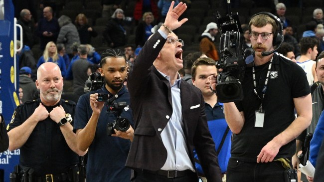 UConn basketball coach Dan Hurley waves to the Creighton crowd.