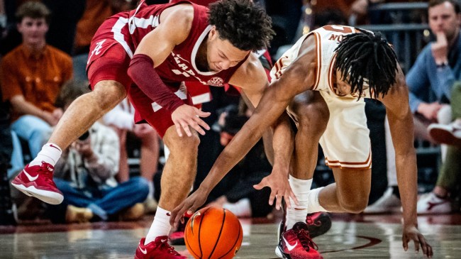 Alabama basketball player Mark Sears battles for a loose ball.
