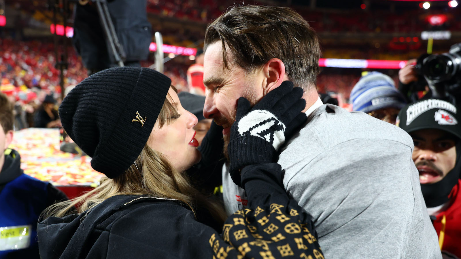 Jan 26, 2025; Kansas City, MO, USA; Recording artist Taylor Swift and Kansas City Chiefs tight end Travis Kelce (87) react after the AFC Championship game against the Buffalo Bills at GEHA Field at Arrowhead Stadium. Mandatory Credit: Mark J. Rebilas-Imagn Images