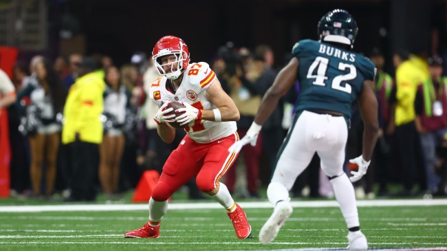 Feb 9, 2025; New Orleans, LA, USA; Kansas City Chiefs tight end Travis Kelce (87) catches a pass against Philadelphia Eagles linebacker Oren Burks (42) in the fourth quarter in Super Bowl LIX at Ceasars Superdome. Mandatory Credit: Mark J. Rebilas-Imagn Images