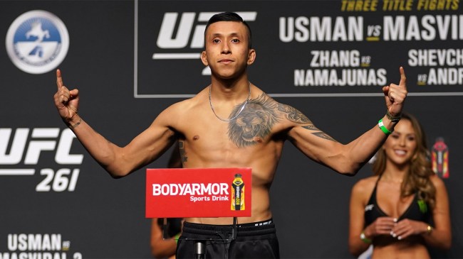 Jeff Molina gestures while on the scale during weigh-ins for UFC 261