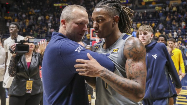 West Virginia basketball coach Darian DeVries meets with Javon Small.