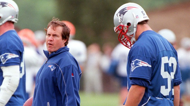 Bill-Belichick-talks-with-Ted-Johnson