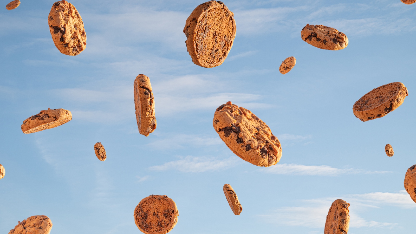 cookies raining in front of blue skies