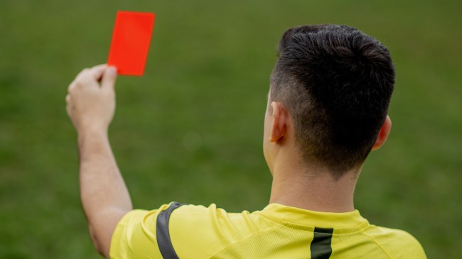 Soccer ref holding red card