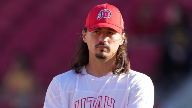 Utah QB Cam Rising stands on the field