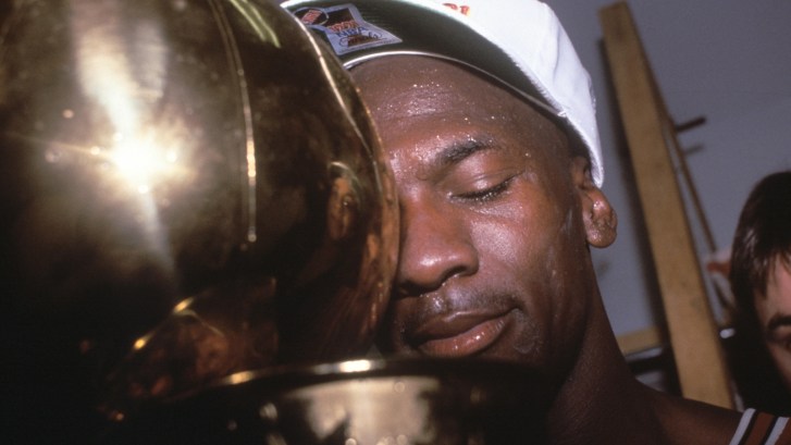Michael Jordan hugging NBA Championship trophy in 1991